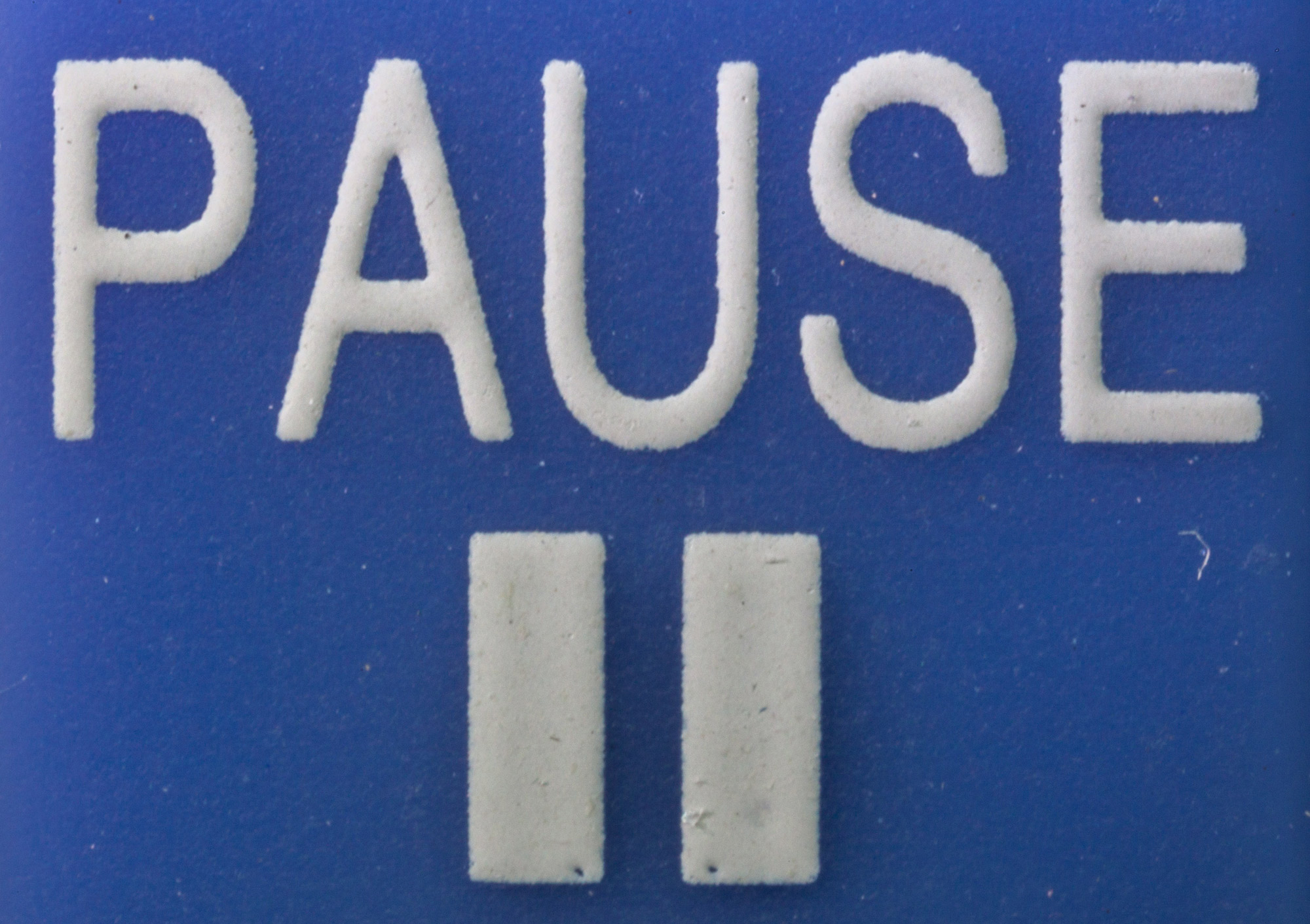 PAUSE-button_-_Macro_photography_of_a_remote_control