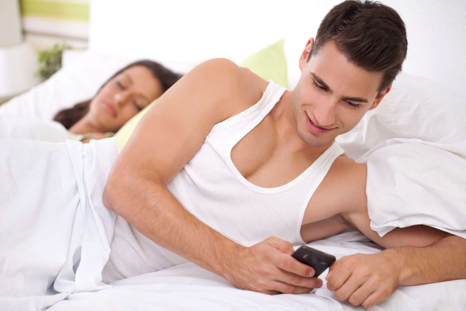 Cheating his wife, young men chatting with his mistress while his wife sleeps; Shutterstock ID 111366542; PO: The Huffington Post; Job: The Huffington Post; Client: The Huffington Post; Other: The Huffington Post